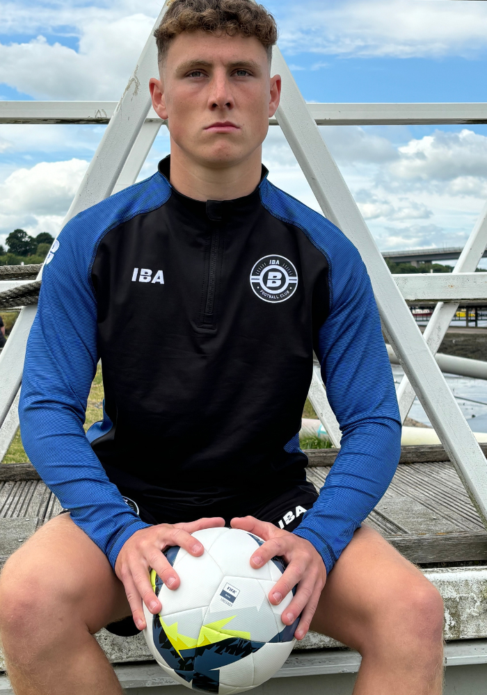 PERFORMANCE QUARTER ZIP TOP BLACK/ROYAL BLUE