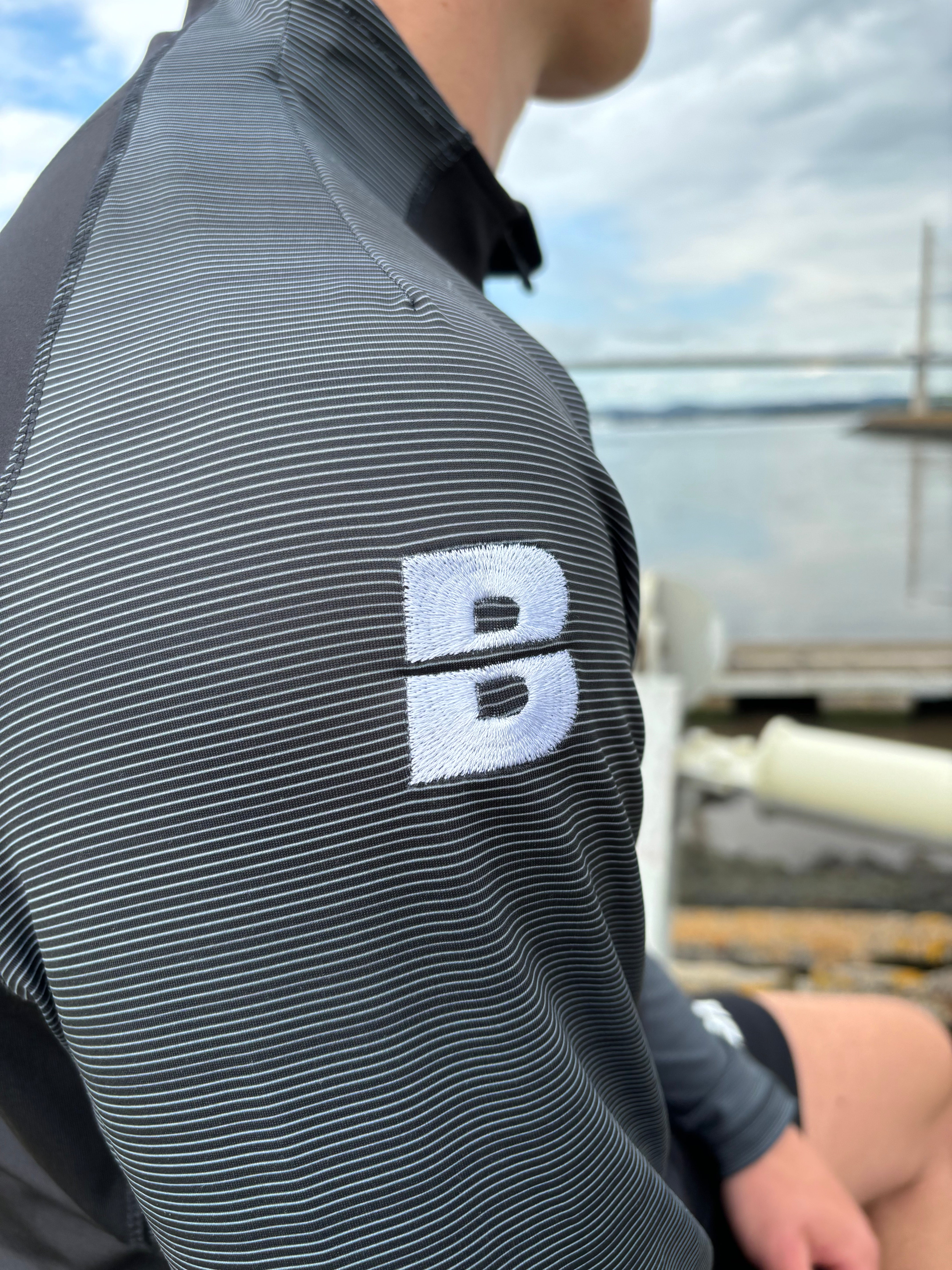 PERFORMANCE QUARTER ZIP TOP BLACK/GRAPHITE