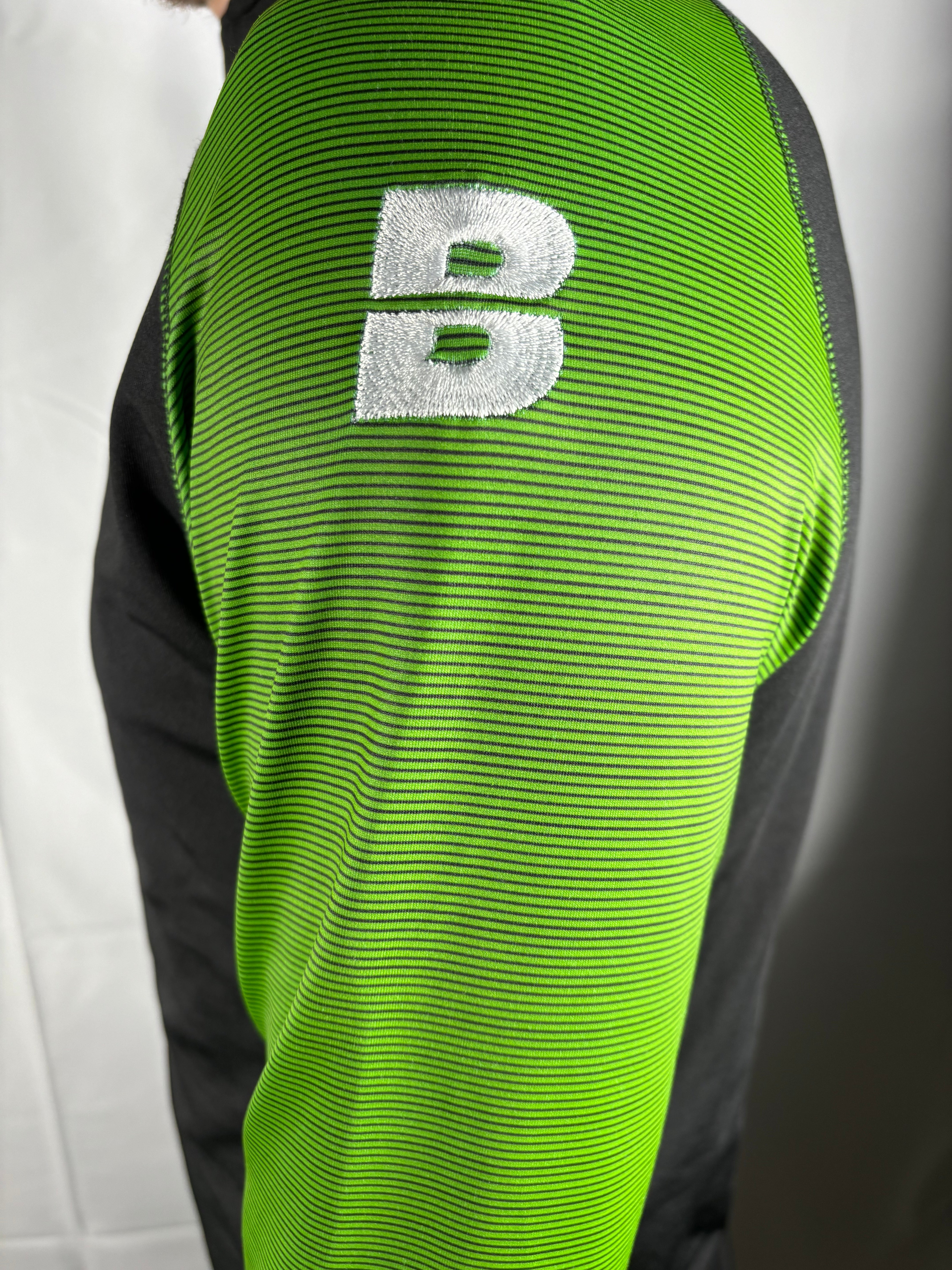 PERFORMANCE QUARTER ZIP TOP BLACK/GREEN